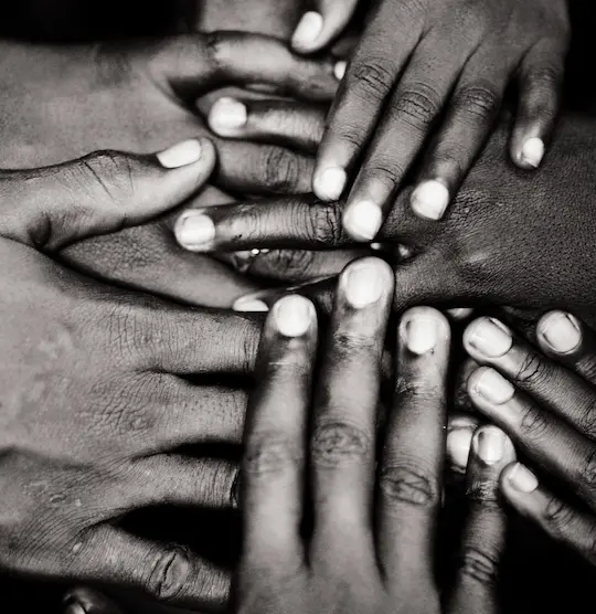 Understand the Culture. Know the History. Pass It On. Hands are gathered in solidarity